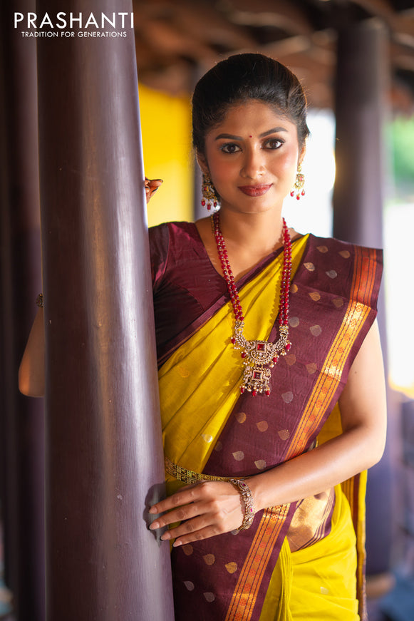 Kuppadam silk cotton saree lime yellow and deep maroon with silver & gold zari woven tilak buttas and temple design rettapet zari woven butta border