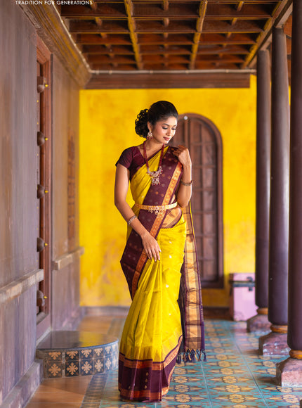 Kuppadam silk cotton saree lime yellow and deep maroon with silver & gold zari woven tilak buttas and temple design rettapet zari woven butta border