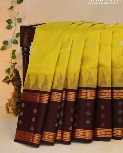 Kuppadam silk cotton saree lime yellow and deep maroon with silver & gold zari woven tilak buttas and temple design rettapet zari woven butta border