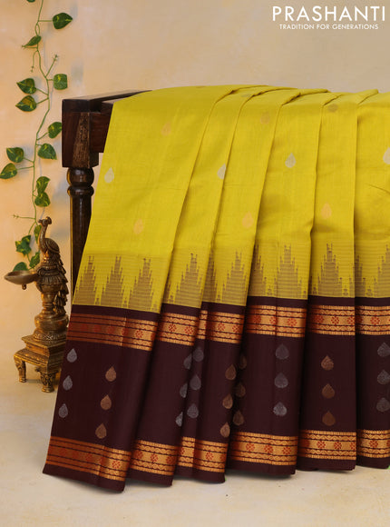 Kuppadam silk cotton saree lime yellow and deep maroon with silver & gold zari woven tilak buttas and temple design rettapet zari woven butta border