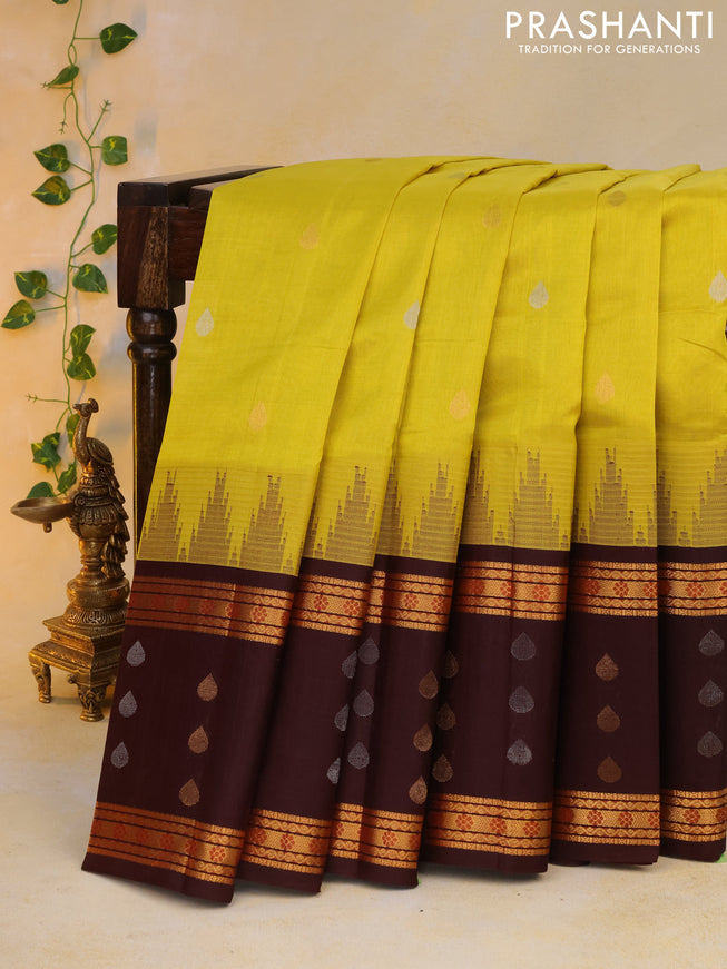 Kuppadam silk cotton saree lime yellow and deep maroon with silver & gold zari woven tilak buttas and temple design rettapet zari woven butta border