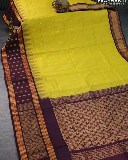 Kuppadam silk cotton saree lime yellow and deep maroon with silver & gold zari woven tilak buttas and temple design rettapet zari woven butta border