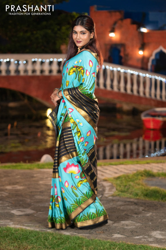 Pure mysore silk saree light blue and black with zari stripes pattern and long zari woven pichwai printed border