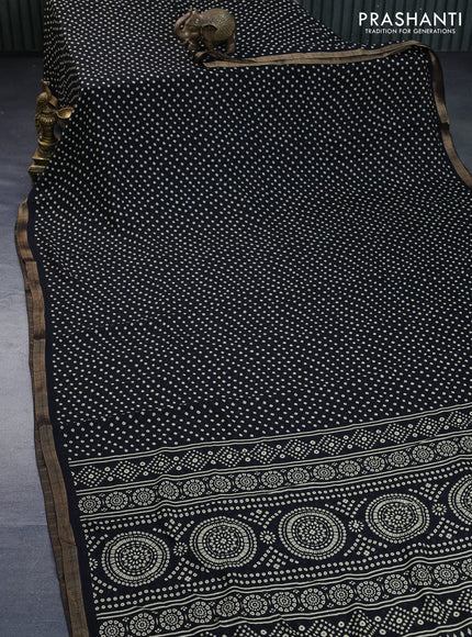 Semi georgette saree black with allover bandhani prints and zari woven border