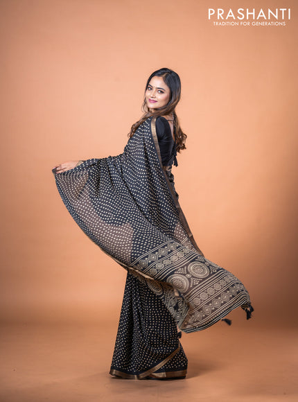 Semi georgette saree black with allover bandhani prints and zari woven border