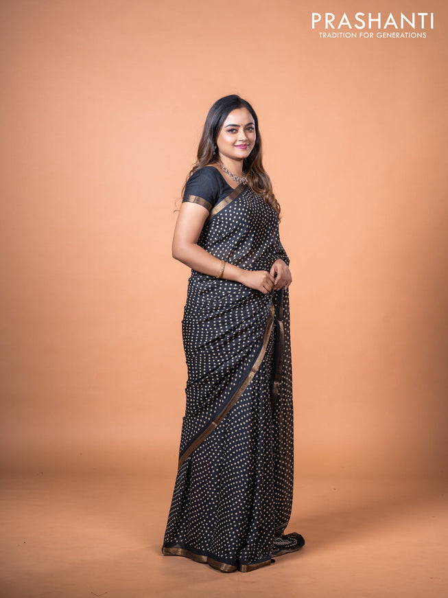 Semi georgette saree black with allover bandhani prints and zari woven border