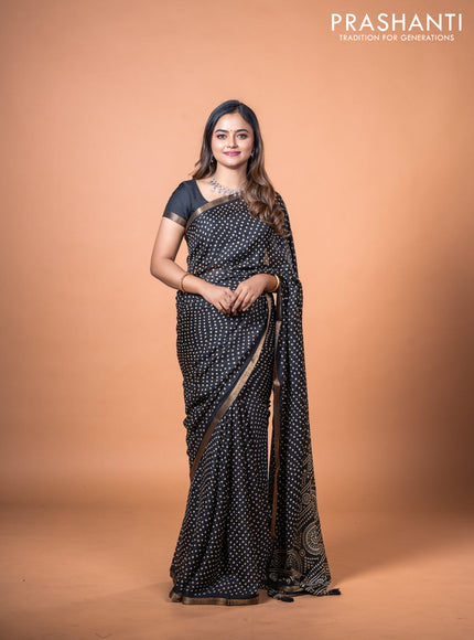 Semi georgette saree black with allover bandhani prints and zari woven border