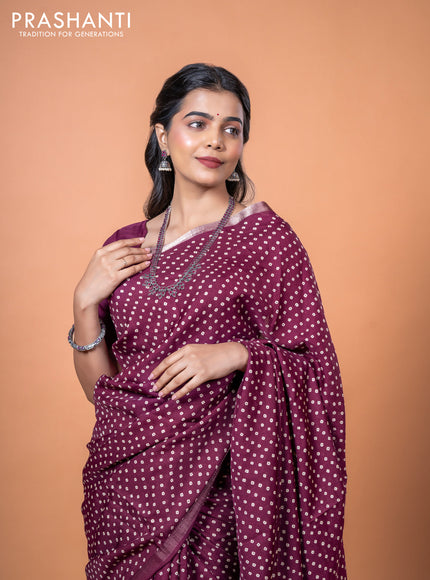 Semi georgette saree wine shade with allover bandhani prints and zari woven border