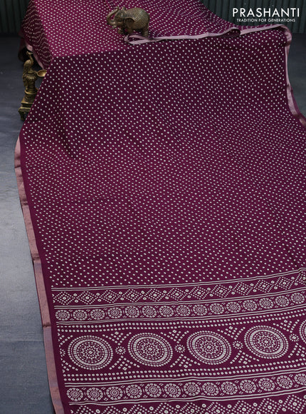 Semi georgette saree wine shade with allover bandhani prints and zari woven border