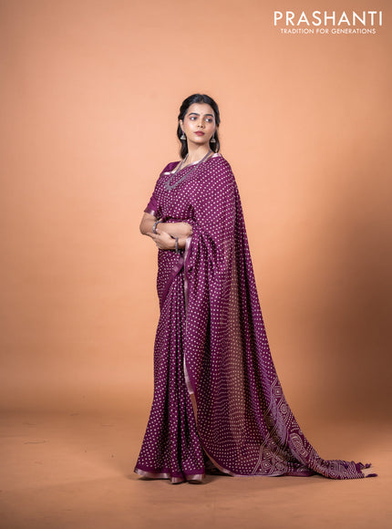 Semi georgette saree wine shade with allover bandhani prints and zari woven border