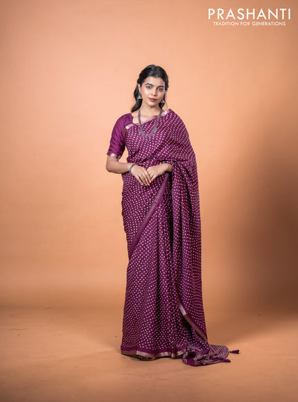 Semi georgette saree wine shade with allover bandhani prints and zari woven border