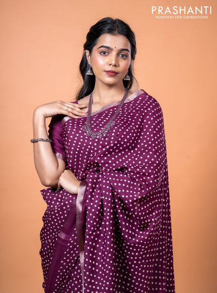 Semi georgette saree wine shade with allover bandhani prints and zari woven border