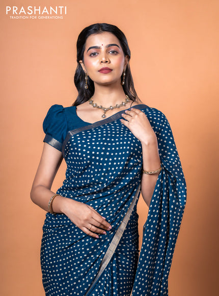 Semi georgette saree peacock blue with allover bandhani prints and zari woven border