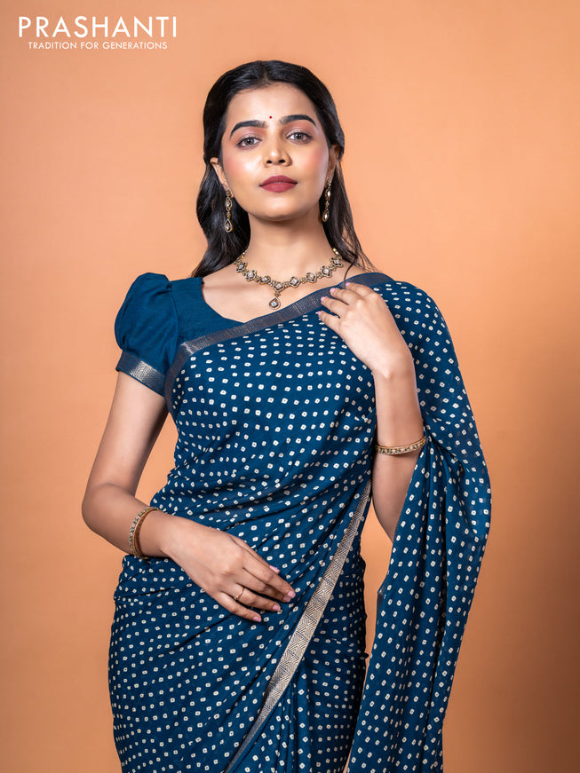 Semi georgette saree peacock blue with allover bandhani prints and zari woven border