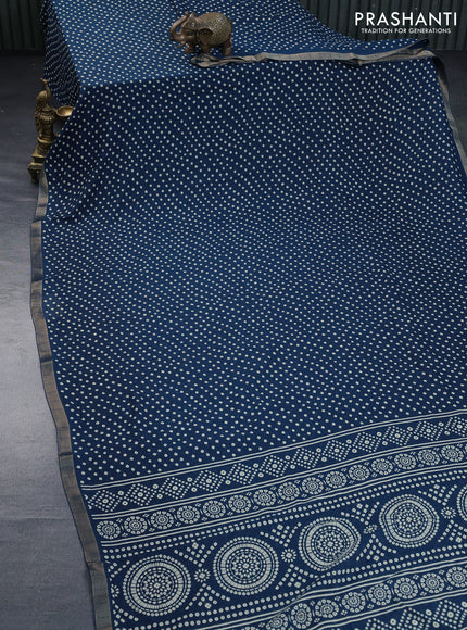 Semi georgette saree peacock blue with allover bandhani prints and zari woven border