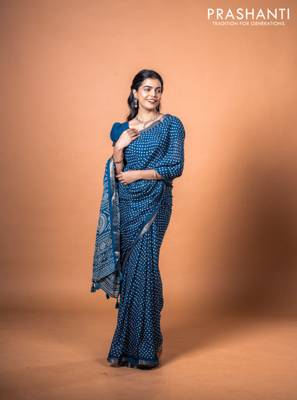 Semi georgette saree peacock blue with allover bandhani prints and zari woven border