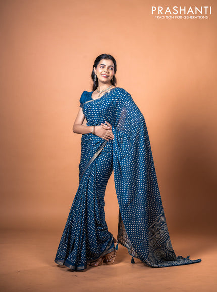 Semi georgette saree peacock blue with allover bandhani prints and zari woven border