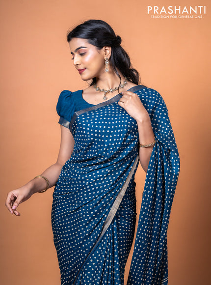 Semi georgette saree peacock blue with allover bandhani prints and zari woven border