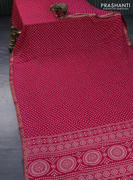 Semi georgette saree pink with allover bandhani prints and zari woven border