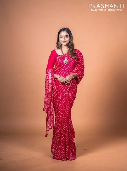 Semi georgette saree pink with allover bandhani prints and zari woven border