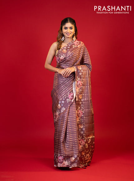 Semi tussar saree brown shade with allover zari woven stripes pattern and floral printed border