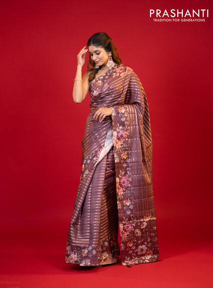 Semi tussar saree brown shade with allover zari woven stripes pattern and floral printed border