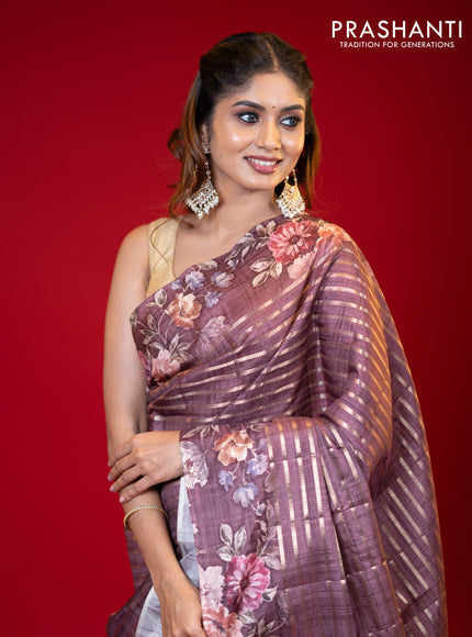 Semi tussar saree brown shade with allover zari woven stripes pattern and floral printed border