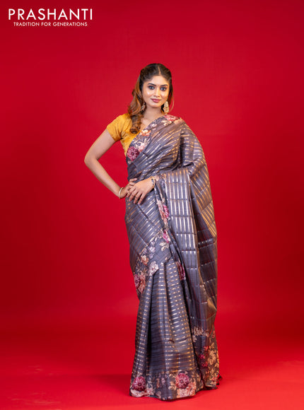 Semi tussar saree grey shade with allover zari woven stripes pattern and floral printed border