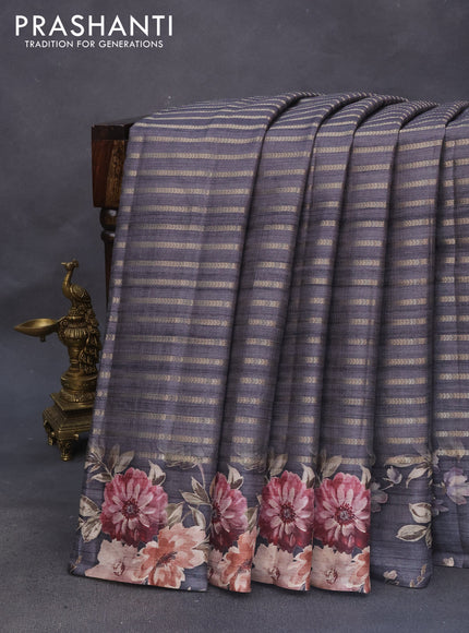 Semi tussar saree grey shade with allover zari woven stripes pattern and floral printed border