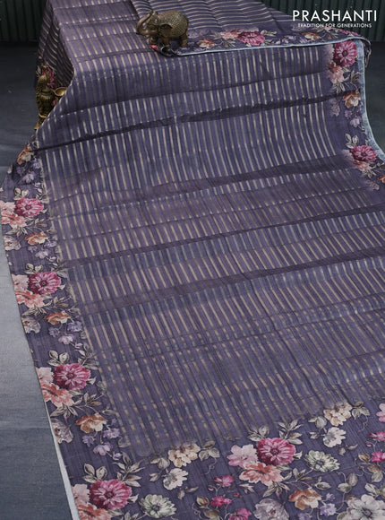 Semi tussar saree grey shade with allover zari woven stripes pattern and floral printed border