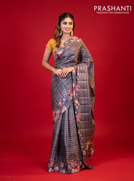 Semi tussar saree grey shade with allover zari woven stripes pattern and floral printed border