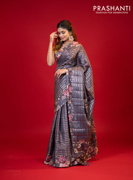 Semi tussar saree grey shade with allover zari woven stripes pattern and floral printed border