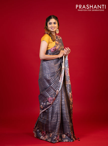 Semi tussar saree grey shade with allover zari woven stripes pattern and floral printed border