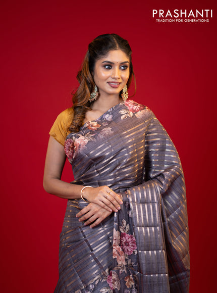 Semi tussar saree grey shade with allover zari woven stripes pattern and floral printed border