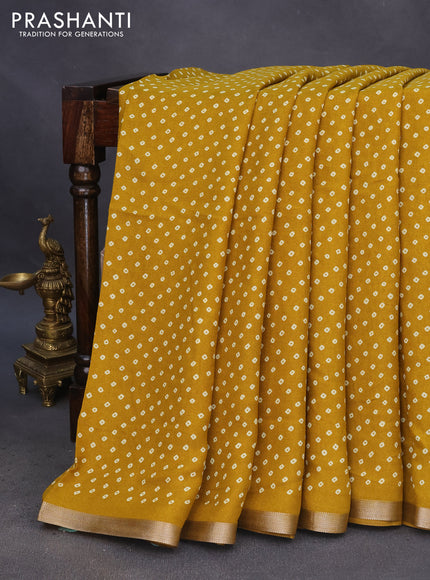 Semi georgette saree mustard yellow with allover bandhani prints and zari woven border