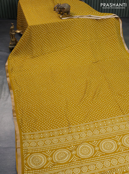 Semi georgette saree mustard yellow with allover bandhani prints and zari woven border