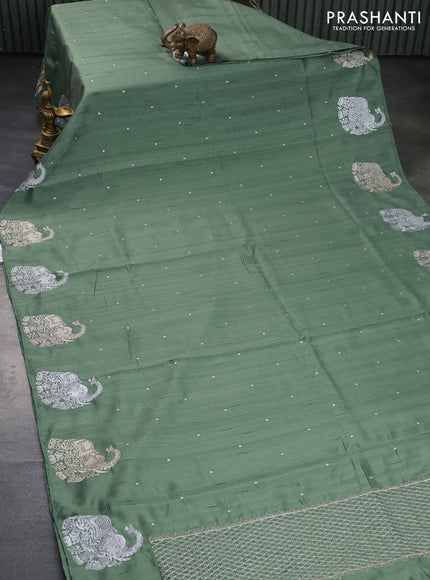 Semi tussar saree pastel green with zari woven buttas and elephant zari woven butta border