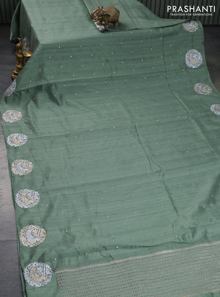 Semi tussar saree pastel green with zari woven buttas and zari woven butta border