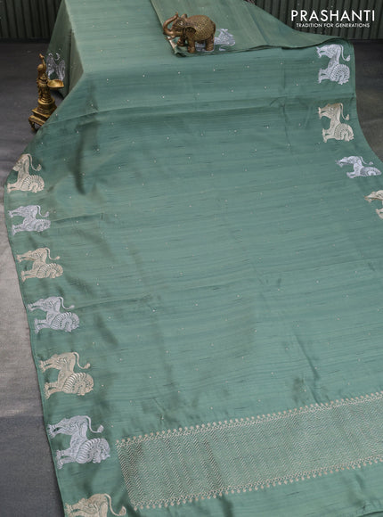 Semi tussar saree pastel green with zari woven buttas and zari woven butta border