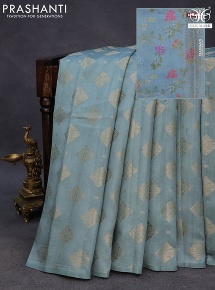 Chiniya silk saree pastel blue shade with allover zari woven butta weaves in borderless style