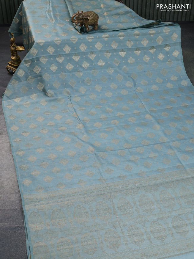 Chiniya silk saree pastel blue shade with allover zari woven butta weaves in borderless style