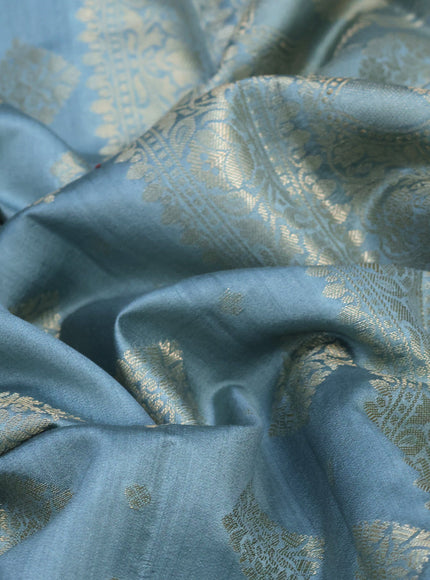 Chiniya silk saree pastel blue shade with allover zari woven butta weaves in borderless style