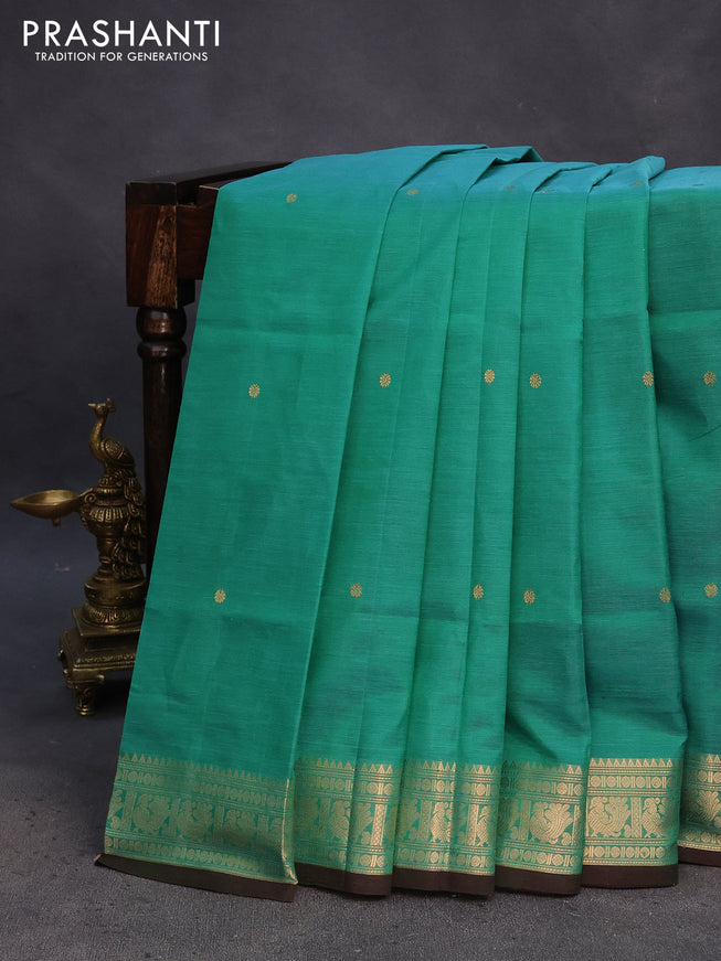 Kanchipuram silk cotton saree teal green shade with zari woven buttas and annam zari woven border