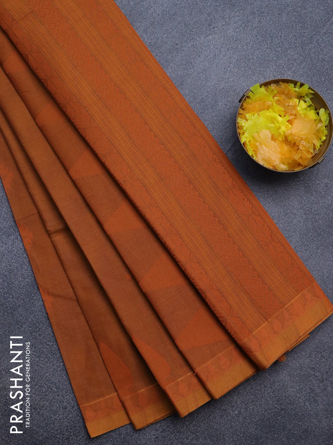 Nithyam cotton saree rust shade with allover thread woven buttas and woven border