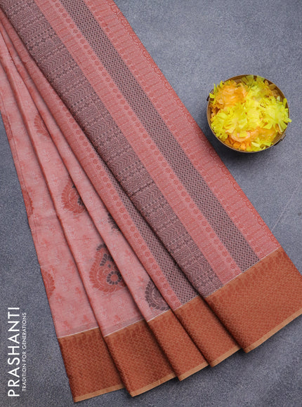 Nithyam cotton saree rust shade with allover self emboss & thread buttas and thread woven border