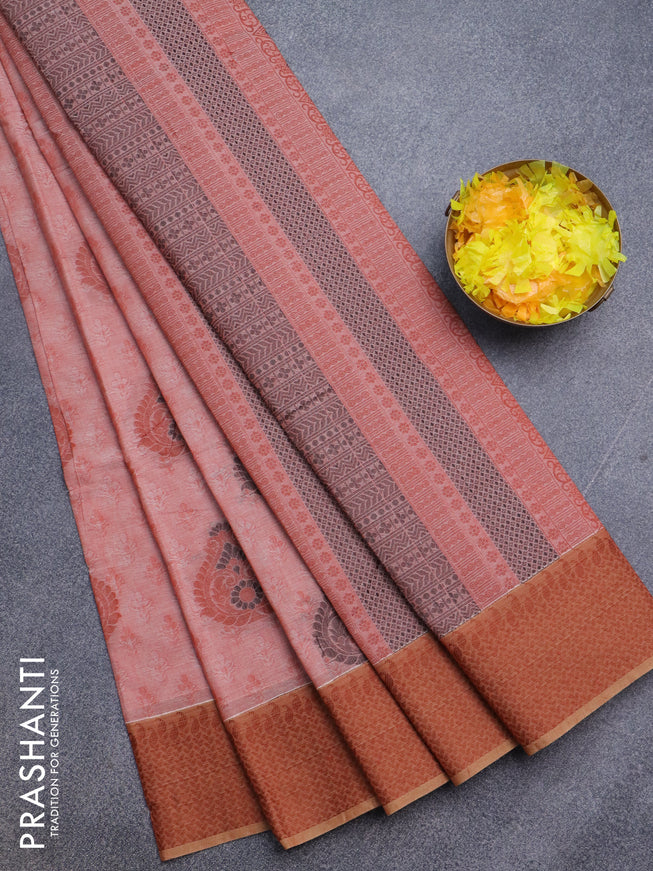 Nithyam cotton saree rust shade with allover self emboss & thread buttas and thread woven border