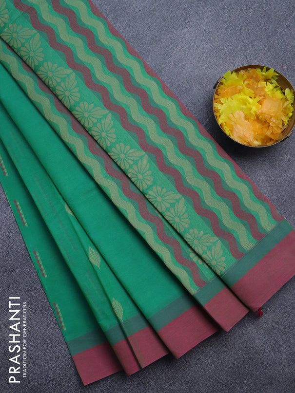 Nithyam cotton saree green and pink with allover thread woven buttas and simple border