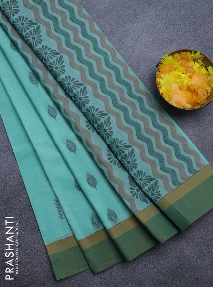 Nithyam cotton saree teal blue shade and green with allover thread woven buttas and simple border