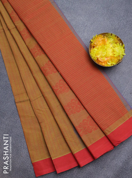 Nithyam cotton saree dual shade of dark mustard and red with allover thread stripe & buttas and simple border