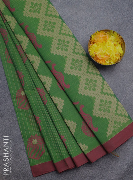 Nithyam cotton saree green and maroon with allover checked pattern & thread buttas and simple border